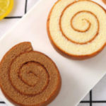 Two pieces of chocolate vanilla pinwheel cookies